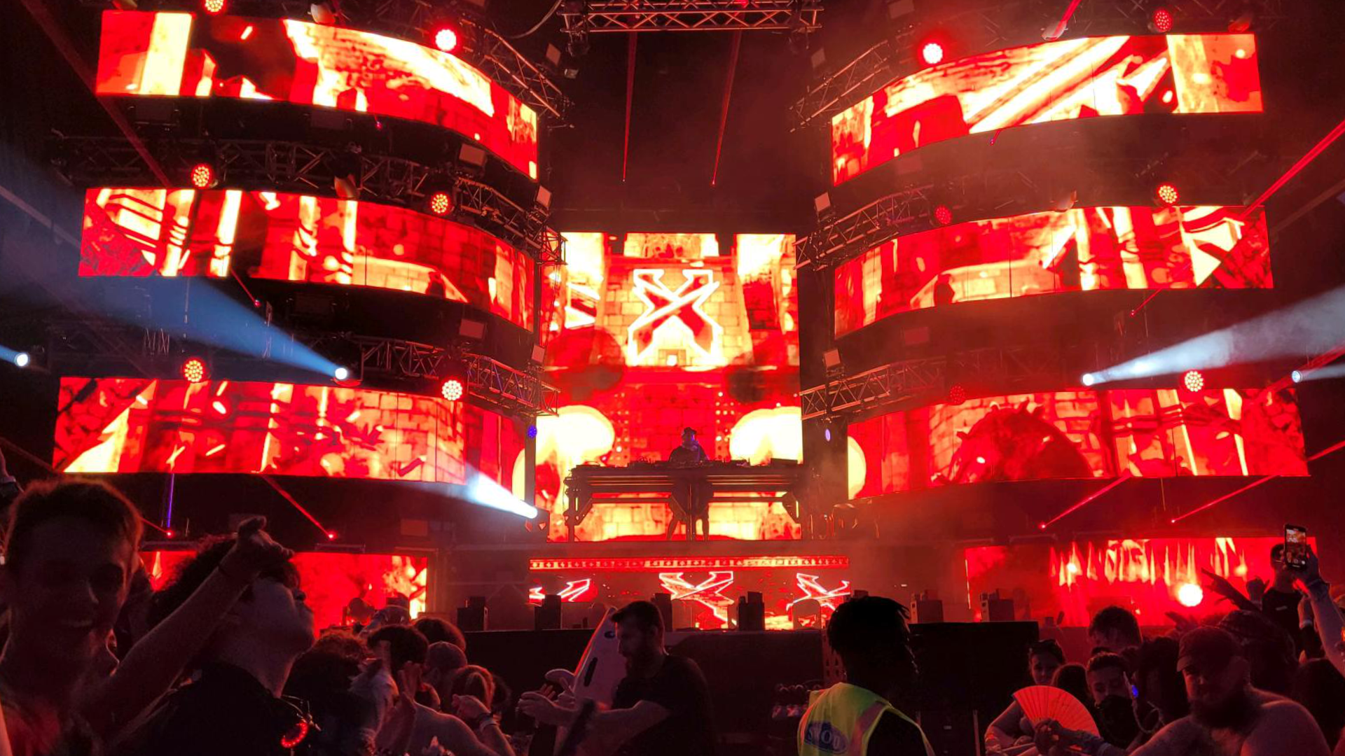 An EDM concert with several video wall panels