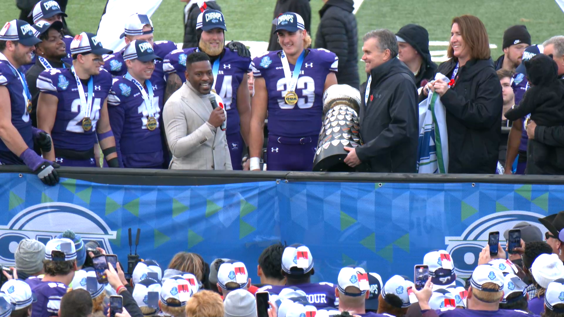 A football team celebrates a Yates Cup victory