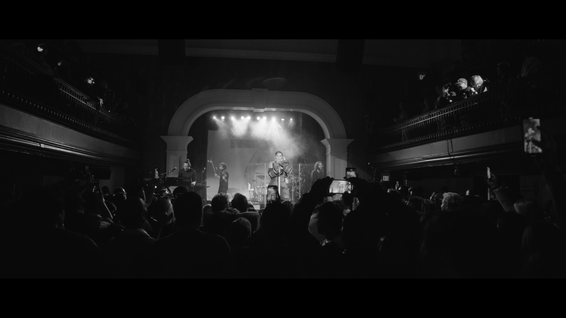 A black and white still of a Nelly Furtado concert in Toronto